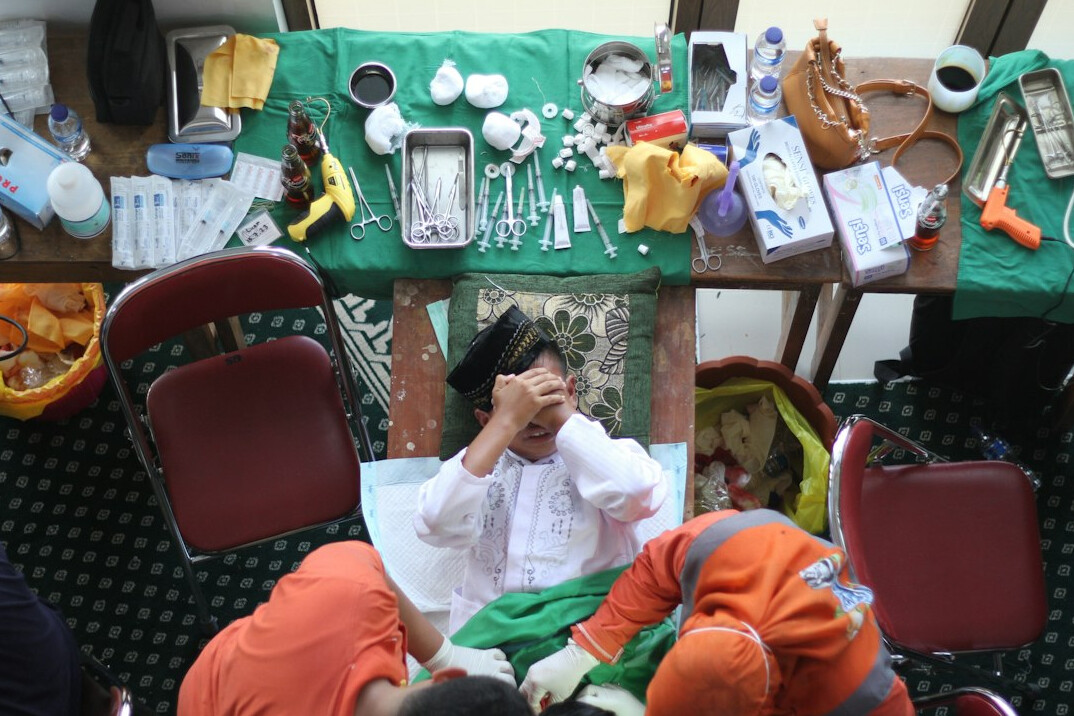 Small group of researchers in discussion around a table